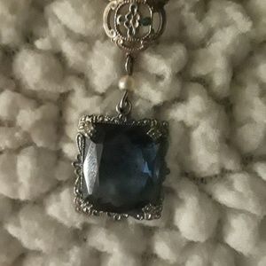 10k white gold necklace with blue topaz pendant